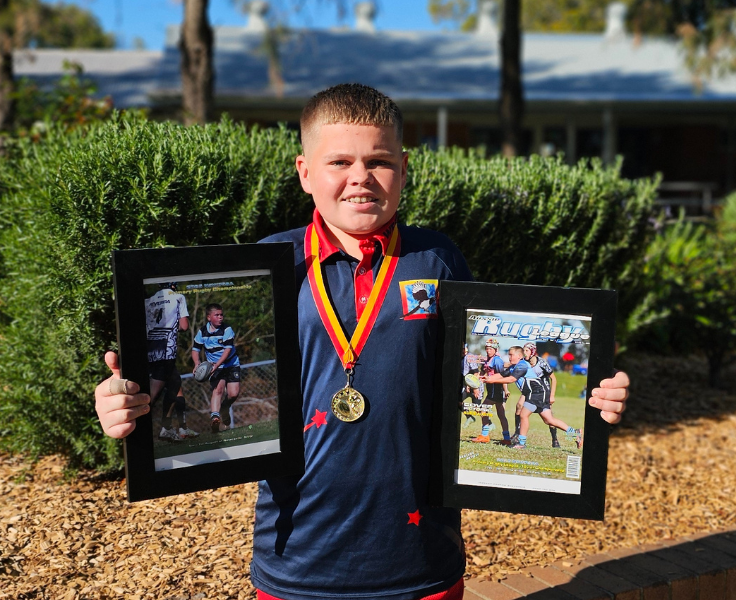 Image of Westdale Public School Student Holding Awards